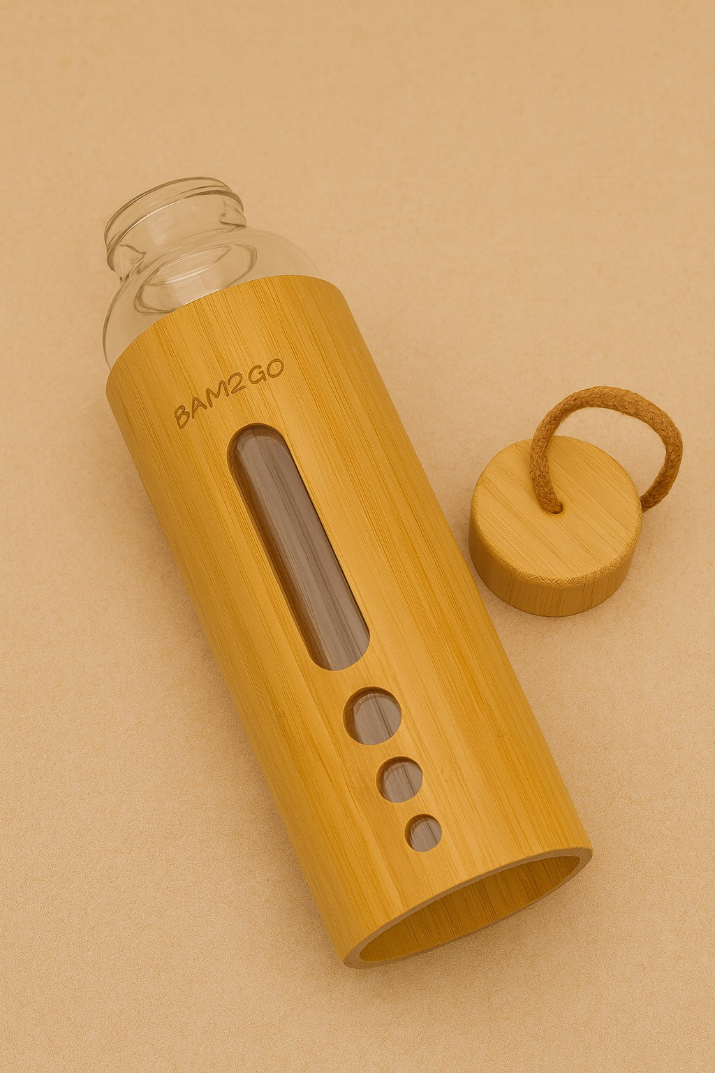 Bamboo water bottle with glass container on a beige background
