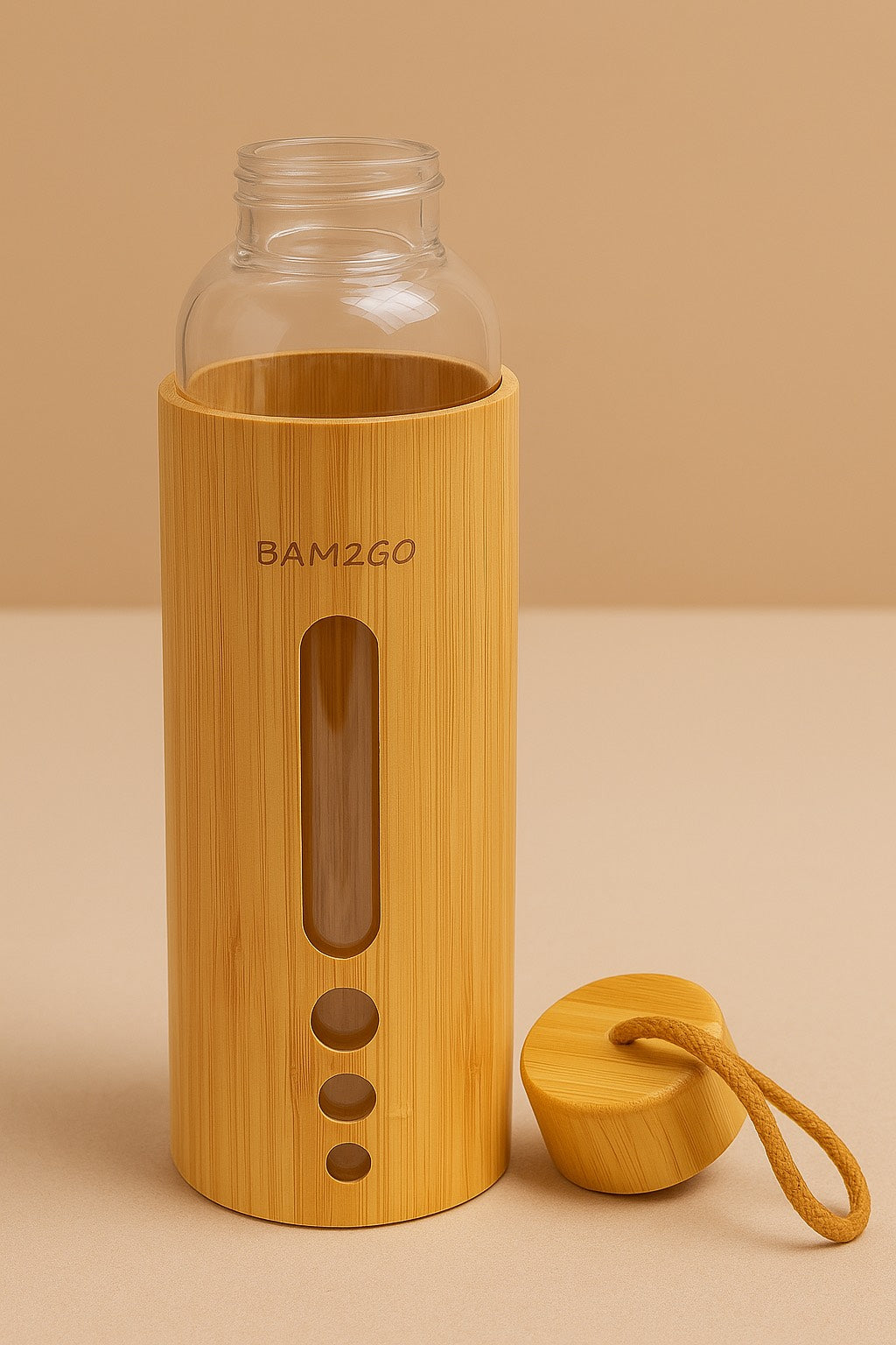 Bamboo water bottle with clear glass body and wooden cap on a beige background