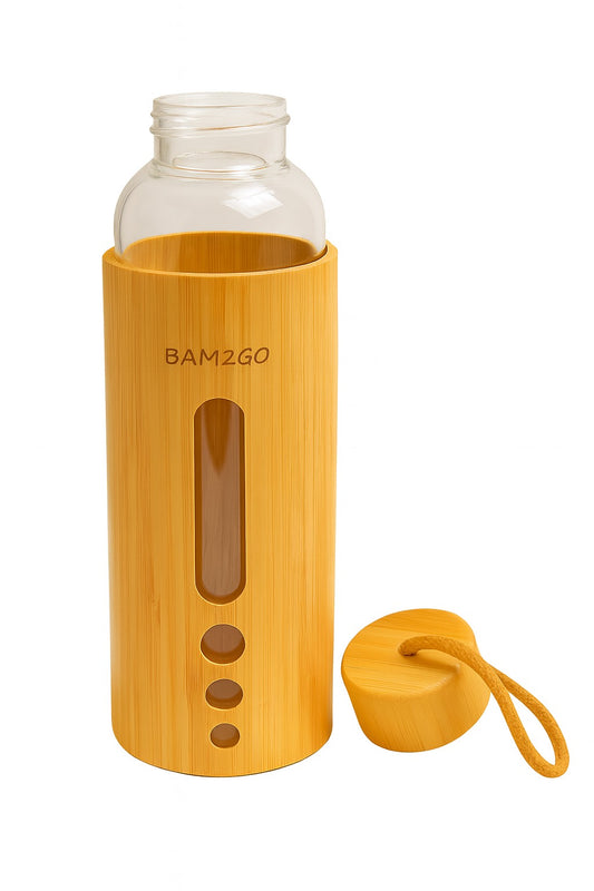 Bamboo water bottle with a clear glass top and yellow base on a white background