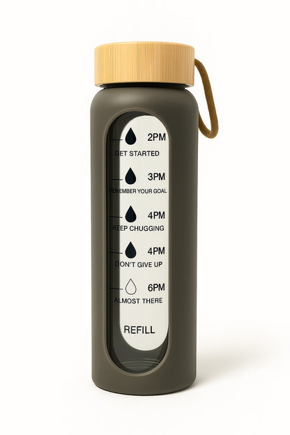 Gray water bottle with bamboo cap and motivational message on a white background