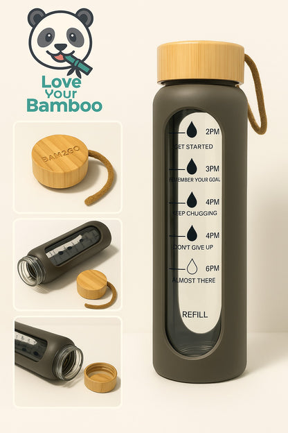 Bamboo water bottle with motivational time markers and bamboo cap on a beige background.
