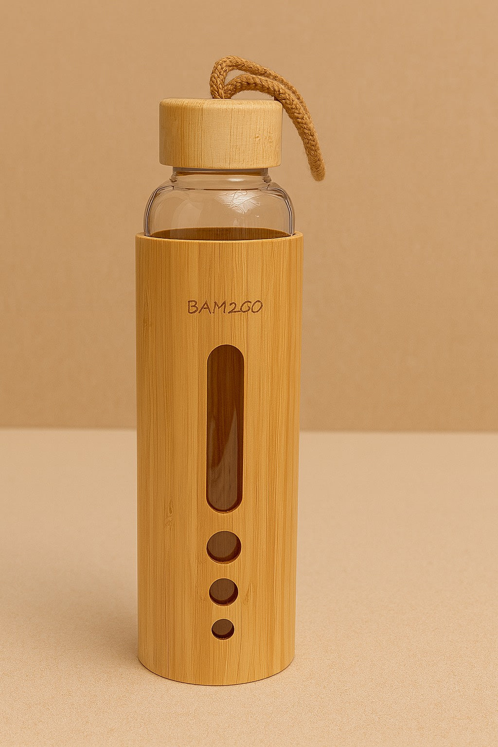 Bamboo water bottle with glass body on a beige background
